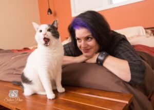 Feline behaviorist Marci Koski smiling at a cat